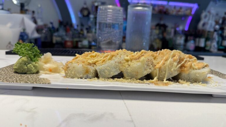 A shared table at Niji Sushi Bar & Grill in Springfield with the Rainbow Roll and Avocado Bang Bang ready to enjoy